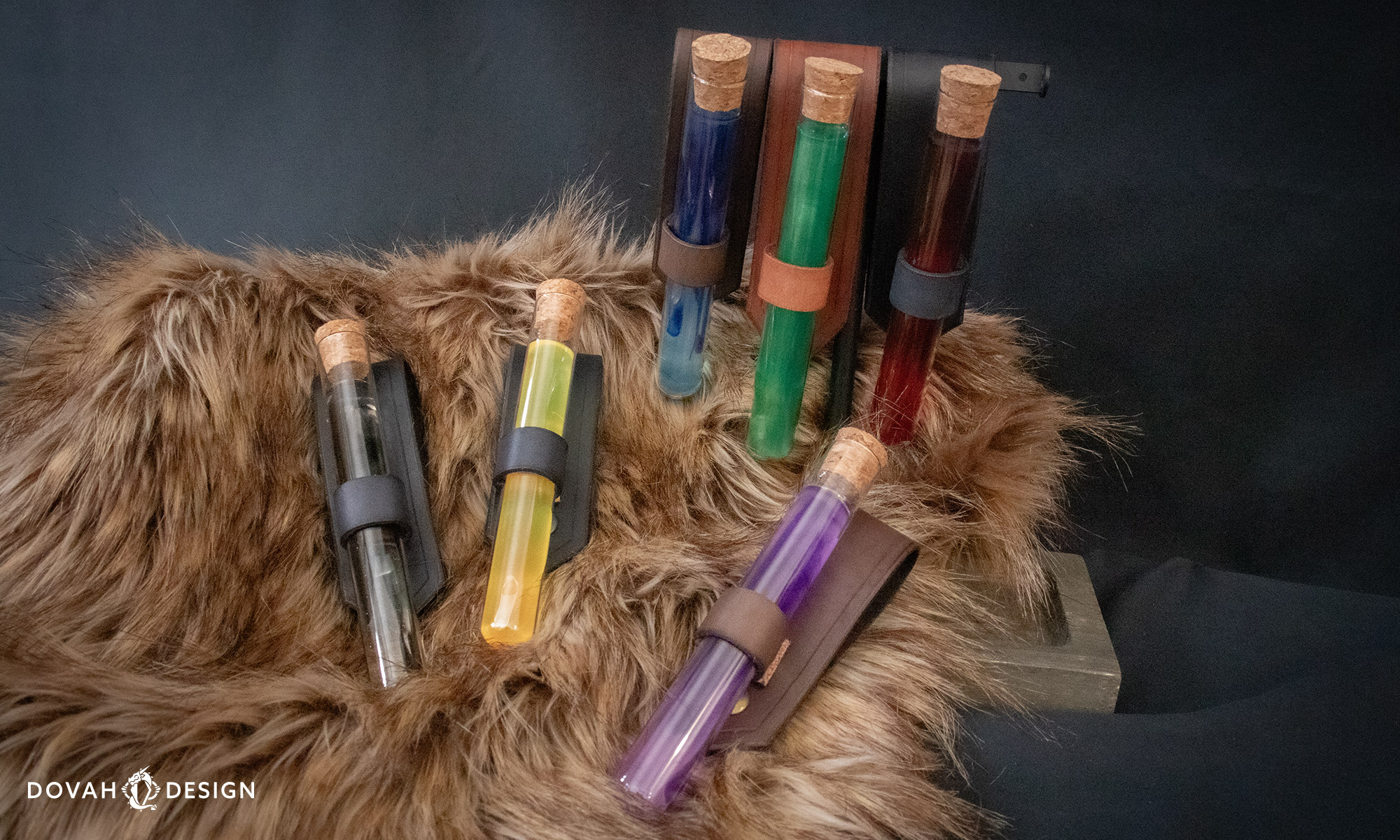Six costume potion holsters in various colors displayed on brown fur and a black background. Ren fair potion costume accessory.