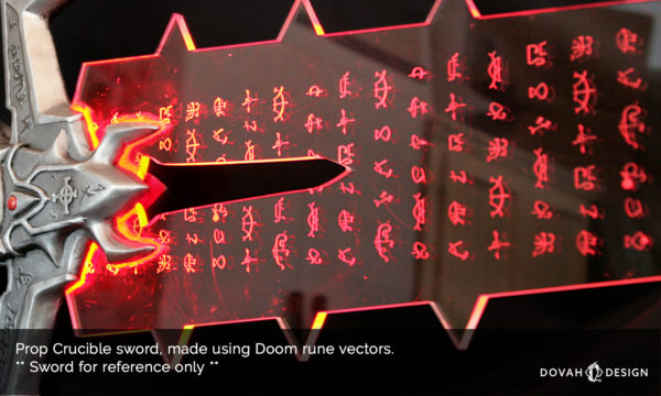 Close up detail of laser etched runes on prop Crucible sword, with text over top that reads "Prop Crucible sword, made using Doom rune vecotrs. Sword for reference only"