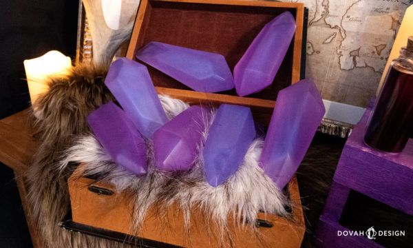Seven soul gem props displayed in an open box, surrounded by a Skyrim themed set.