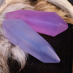 Close detail of two lesser soul gems on top of white and brown fur.