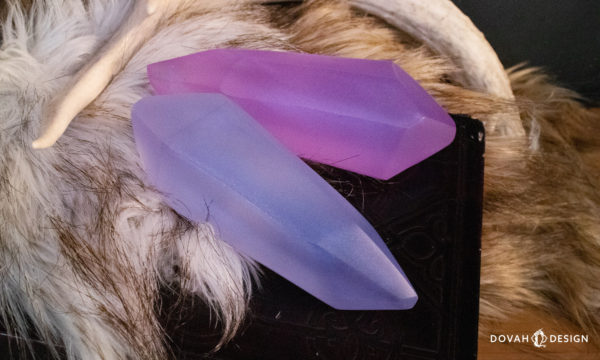 Close detail of two lesser soul gems on top of white and brown fur.