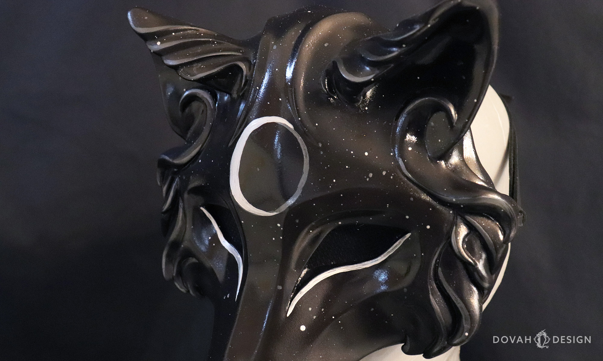 3/4 right view close up of "Hati" black and silver wolf moon mask, based on Norse mythology.